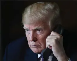  ?? SUSAN WALSH — THE ASSOCIATED PRESS ?? President Donald Trump talks with troops via teleconfer­ence from his Mar-a-Lago estate in Palm Beach, Fla., on Thursday.