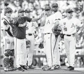  ?? NWA Democrat-Gazette/BEN GOFF • @NWABENGOFF ?? Dave Van Horn, Arkansas head coach, tries to get an umpire’s attention to make a pitching change in the third inning Thursday during Game 3 of the NCAA Men’s College World Series finals at TD Ameritrade Park in Omaha, Neb.