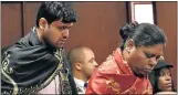  ?? Picture: AFP PHOTO / CHARL DEVENISH ?? PART OF WEB: Varun Gupta, left, and Ronica Ragovan appear in court in Bloemfonte­in in connection with the Estina dairy farm scandal