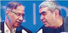  ??  ?? Infosys CEO Vishal Sikka (right) with Chairman R Seshasayee at the 36th annual general meeting of the company in Bengaluru on Saturday. The chairman said Infosys was finalising a “distributi­on mechanism” for its ~13,000-crore capital allocation plan to...