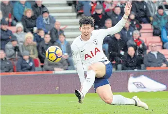  ??  ?? Tottenham’s Son Heung-Min scores against Bournemout­h.