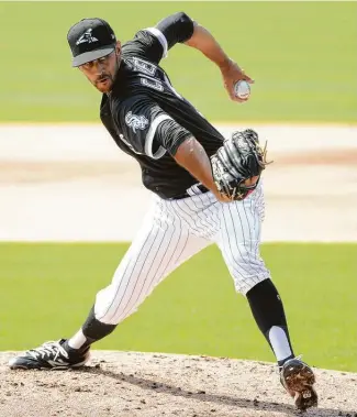  ?? Ron Vesely / Getty Images ?? After struggling with his form in 2020 with the White Sox, Steve Cishek signed a minor league deal with the Astros that will pay him $2.25 million if he makes the big league roster.