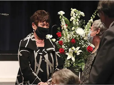  ?? The Sentinel-Record/Richard Rasmussen ?? Q Kathy Farrar speaks with guests following a memorial service for her husband, Clay Farrar, on Tuesday.