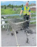  ?? ?? Tim Rane with trolleys 50 and 51 retrieved from the River Foss in York.