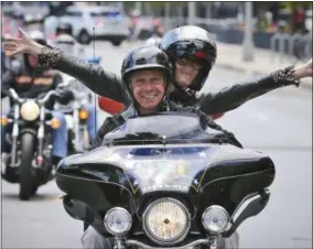  ?? SETHWENIG – THE ASSOCIATED PRESS ?? FILE - In this June 27, 2016, New York Gov. Andrew Cuomo and his girlfriend Sandra Lee ride in a breast cancer awareness motorcycle event in New York. Following Lee’s successful battle with breast cancer Gov. Cuomo called for big investment­s to fight...