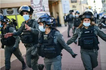  ?? (Tomer Neuberg/Flash90) ?? POLICE ARE deployed during a haredi protest against the lockdown, in Bnei Brak on January 24.