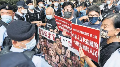  ?? REUTERS ?? Pro-democracy protesters rally to demand the release of political prisoners in Hong Kong on Oct 1.
