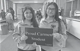  ?? RORY LINNANE/MILWAUKEE JOURNAL SENTINEL ?? Tatiana Serna and America Perez, students at Carmen South High School, attended a school board meeting April 23.