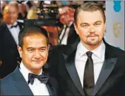  ?? Andrew Cowie AFP/Getty Images ?? RIZA AZIZ, left, helped finance the film “The Wolf of Wall Street, ” which featured Leonardo DiCaprio.