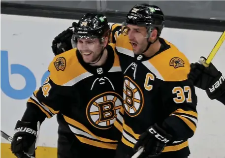  ?? STuART CAHILL / HeRALd sTAFF FILe ?? STORM WARNING: The continuati­on of the strong play of Jake DeBrusk, left, and a final playoff run for Patrice Bergeron, right, are just two things to watch for in the Bruins’ series with Carolina.