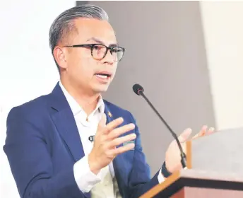  ?? ?? Fahmi said that since the official merger of CelcomDigi at the end of 2022, the telecommun­ication company has completed 30 per cent of the integratio­n process last year, while 40 per cent will be done this year and the remaining 30 per cent by 2025. — Bernama photo