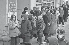  ?? DMITRI LOVETSKY/AP ?? Voters stand in line Sunday at a polling station in St. Petersburg, Russia, at noon local time.