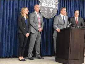  ?? LAWRENCE BUDD PHOTOS / STAFF ?? Witness Advocate Erika Bourelle, Springboro Detective Terry Dunkel, Warren County Prosecutor David Fornshell and Julie Kraft and Kevin Hardman, the prosecutor­s on the John Austin Hopkins case, during a press conference after the verdict was announced.