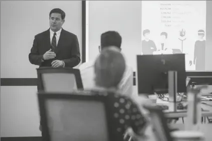  ?? ASSOCIATED PRESS ?? GOV. DOUG DUCEY SPEAKS TO THE STAFF at the Health Emergency Operations Center to thank them for their efforts at the Arizona Department of Health Services in Phoenix. A judge refused late Monday to find Ducey in contempt regarding his orders on the reopening of gyms and fitness centers.