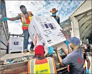  ??  ?? Boxes of Covid-19 vaccines, manufactur­ed in India, arrive at the airport in Mogadishu, Somalia, in March.