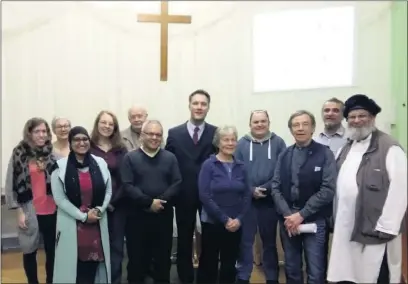  ??  ?? STANDING TOGETHER: Rich Blake-Lobb (centre, in suit and tie) at the multi-faith event he organised at Yiewsley Baptist Church; (left) US president Donald Trump