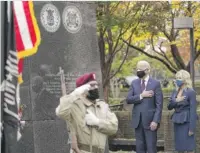  ?? ALEX BRANDON/ AP ?? President- elect Joe Biden and wife Jill Biden attend a Veterans Day service at the Philadelph­ia Korean War Memorial at Penn’s Landing in Philadelph­ia.