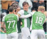  ?? ?? Hibs players celebrate