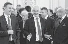  ?? VYACHESLAV PROKOFYEV Sputnik/Pool/ AFP/Getty Images/TNS ?? The economist Andrei Belousov, center, moves from being first deputy prime minister of Russia to defense minister, replacing Sergei Shoigu, in a shuffle by Vladimir Putin.