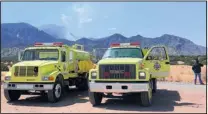  ?? DEAN HANSON/JOURNAL ?? Sandoval County Fire Department crews monitor the Piedra Fire on the north side of Sandia Mountains along N.M. 165 on Thursday. Around 20,000 gallons of water were dropped on the fire, which was zero percent contained as of Thursday evening.