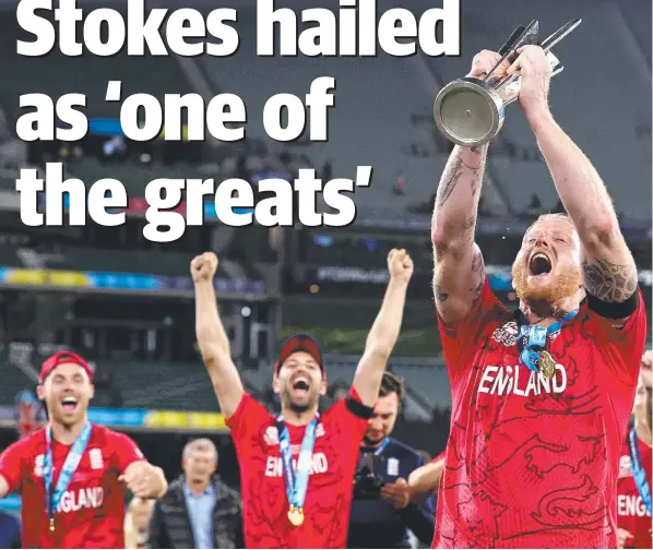  ?? ?? Ben Stokes, watched by his teammates, lifts the trophy after England’s T20 World Cup final victory over Pakistan at the MCG.