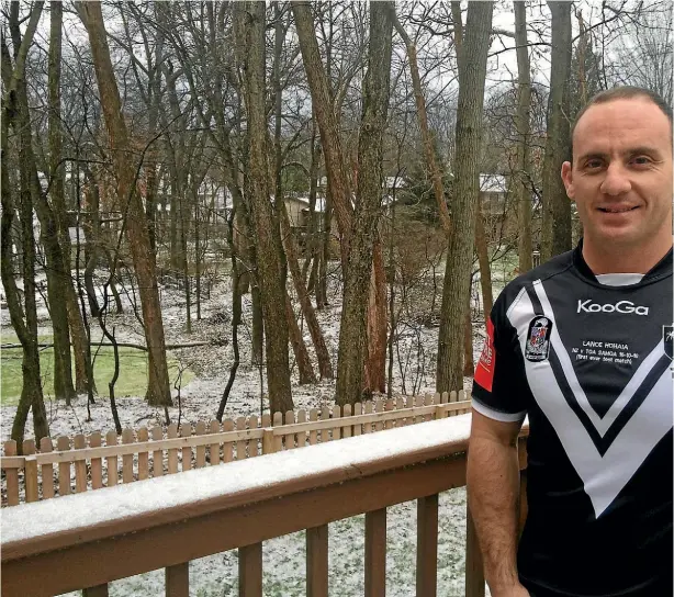  ??  ?? Former Warrior Lance Hohaia pictured in an old Kiwis jersey outside his new home in Grand Rapids, Michigan.