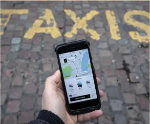  ?? (Simon Dawson/Reuters) ?? THE UBER APP on a mobile telephone in London.