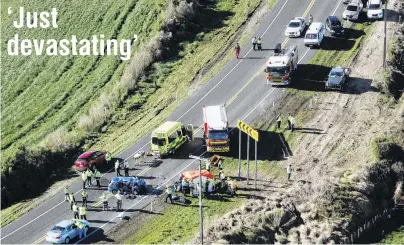  ?? PHOTO: NZME ?? Grim scene . . . Emergency services attend a crash in South Taranaki that killed six people yesterday, including a newborn.