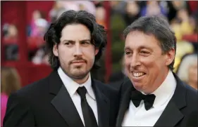  ?? CHRIS PIZZELLO — THE ASSOCIATED PRESS FILE ?? In this Feb. 24, 2008 file photo, Jason Reitman, left, an Oscar nominee for best director for his work on “Juno,” arrives with his father, director Ivan Reitman for