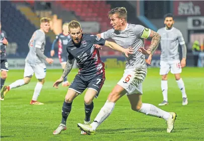  ?? Picture: ?? Lee Ashcroft in action against Ross County during his time as skipper of the Pars.