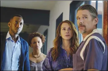  ?? ASSOCIATED PRESS ?? This image released by Netflix shows (from left) Mahershala Ali, Myha’la Herrold, Julia Roberts and Ethan Hawke in a scene from “Leave the World Behind.”