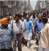  ?? — ASIAN AGE ?? Union minister Vijay Goel visits traders who have been affected by the demolition drive at Laxmi Nagar in East Delhi on Tuesday.