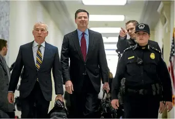  ?? WASHINGTON POST ?? Former FBI director James Comey, centre, has attended a second closed-door interview with House lawmakers.