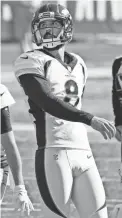  ?? STEVEN SENNE/AP ?? Broncos kicker Brandon McManus watches one of his six field goals against the Patriots on Sunday.