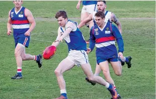  ??  ?? Thorpdale’s Heath Ferguson kicks into attack during the Reserves match against Newborough.