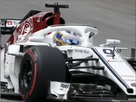  ??  ?? This Nov. 11, file photo shows Sauber driver Marcus Ericsson, of Sweden, steering his car during Brazilian Formula One Grand Prix at the Interlagos race track in Sao Paulo, Brazil. AP PHOTO/ANDRE PENNER