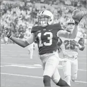  ?? Michael Conroy Associated Press ?? PENN STATE’S Saeed Blacknall celebrates after scoring on a 40-yard touchdown reception.