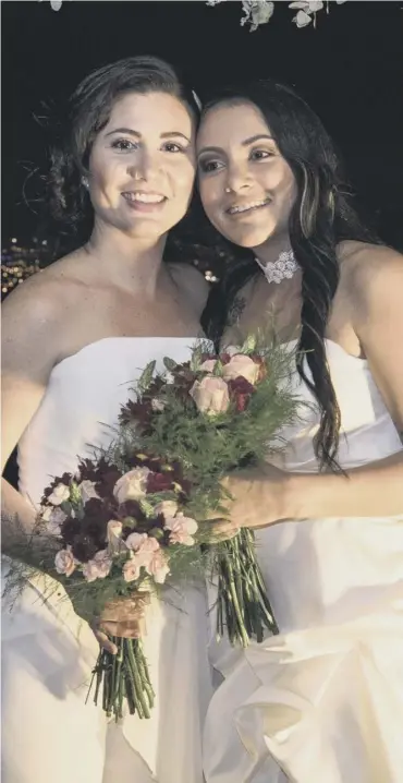  ??  ?? 0 Alexandra Quiros, left, and Dunia Araya were among Costa Rica’s first same-sex newlyweds