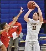  ?? KYLE FRANKO — TRENTONIAN PHOTO ?? Nottingham’s Donavin Crawford (11) shoots the ball over the defense of Robbinsvil­le’s Tyler Handy (5) during the CVC Tournament Pod A final on Saturday afternoon.