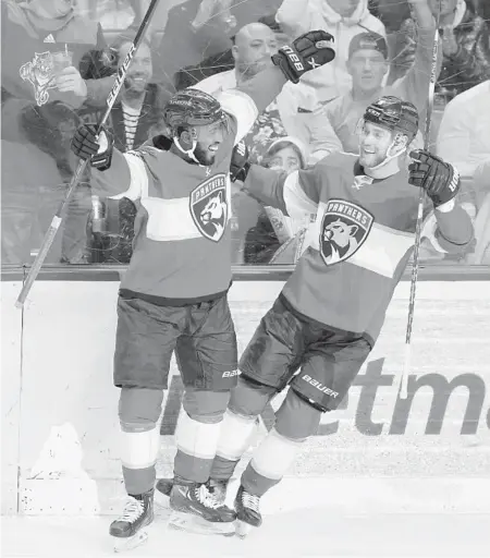  ?? WILFREDO LEE/AP ?? Panthers left wing Anthony Duclair, left, helps center Sam Bennett celebrate his goal during the second period Friday against the Stars in Sunrise.