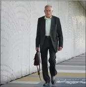  ?? PETER DEJONG — THE ASSOCIATED PRESS ?? Anton Kotte, who lost his son, daughter-in-law and grandson, walks towards the court to listen to testimony of relatives of the victims in the trial of four men charged with murder over the downing of Malaysia Airlines flight MH17, at Schiphol airport, near Amsterdam, Netherland­s, on Monday.