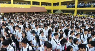  ??  ?? HUNDREDS of students join a flag ceremony at a government school in Manila. The Department of Budget and Management has approved the creation of about 75,000 public school teaching positions for the next school year to address a nationwide teacher...