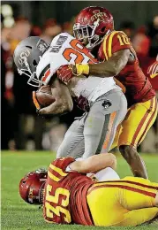  ?? [PHOTO BY NATE BILLINGS, THE OKLAHOMAN] ?? Oklahoma State receiver James Washington is tackled during a 2015 game at Iowa State, a game where the Cowboys had to rally from 10 points down in the fourth quarter for a 35-31 win.