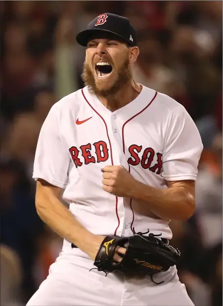  ?? NANCY LANE — BOSTON HERALD ?? Boston Red Sox starting pitcher Chris Sale reacts after striking out Houston Astros’ Kyle Tucker to retire the side during the 4th inning of the ALCS Game 5 at Fenway Park on October 20, 2021 in Boston.