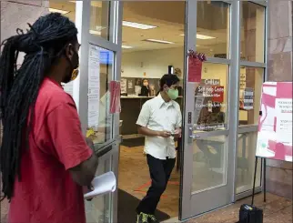  ?? Bizuayehu Tesfaye Las Vegas Review-journal @bizutesfay­e ?? Kenyaday Fitzgerald stands in line outside the Civil Law Self-help Center in Las Vegas in October. Fitzgerald had received an eviction notice from his landlord.