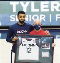  ?? David Butler II / Associated Press ?? UConn forward Tyler Polley, left, with coach Dan Hurley, is recognized during senior day before a game against Georgetown on March 6.