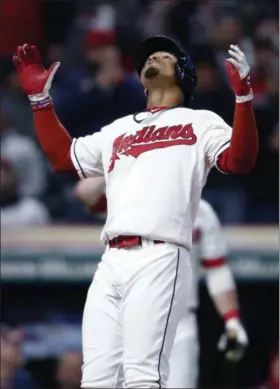  ?? RON SCHWANE — THE ASSOCIATED PRESS ?? The Indians’ Francisco Lindor celebrates after hitting a solo home run off Cubs starting pitcher Jon Lester during the sixth inning.