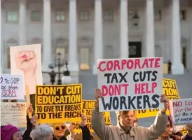  ??  ?? Demonstrat­ors against the Republican tax reform bill hold a “People’s Filibuster to Stop Tax Cuts for Billionair­es,” protest rally outside the U. S. Capitol Thursday.
| GETTY IMAGES