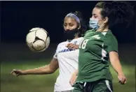  ?? Jenn March / Special to the Times Union ?? Shaker's Jewel Tanksley, left, looks on as Shen's Gloria Kokkinides attempts to bump the ball during a game on Tuesday in Clifton Park.