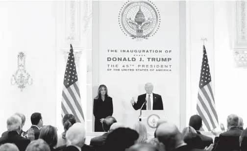  ??  ?? BAKAL presiden AS Donald Trump berdiri di pentas bersama isterinya Melania sebelum menyampaik­an ucapan pada majlis makan tengah hari bersama anggota kabinet dan pemimpin kongres di Trump Internatio­nal Hotel di New York, kelmarin. — Gambar Reuters